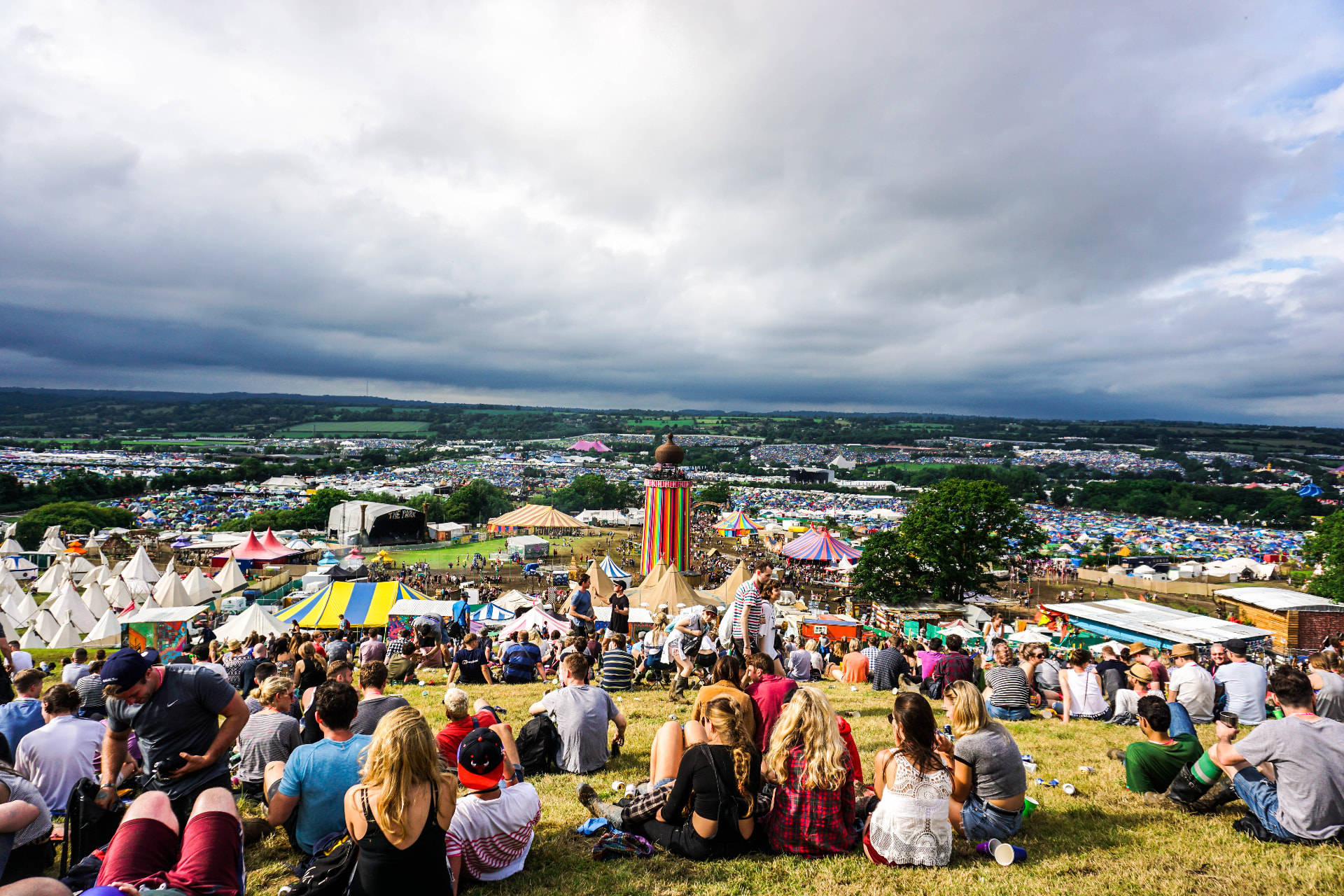 View over a festival campsite and tents from a hillside